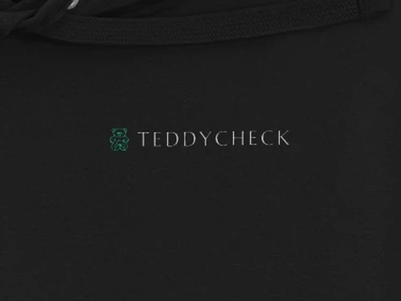 Close-up: TeddyCheck Black Hoodie, logo on the fabric